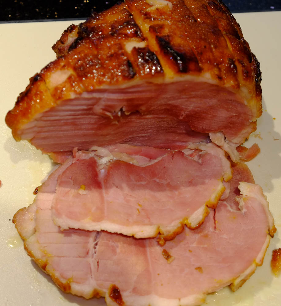 Home cured ham baked with a mustard and honey glaze and sliced.
