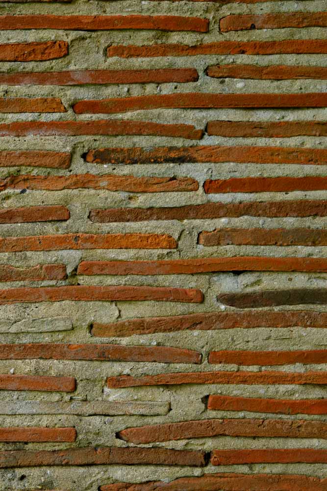 Image of a close up of a supporting column in the pergola made from tiles and mortar
