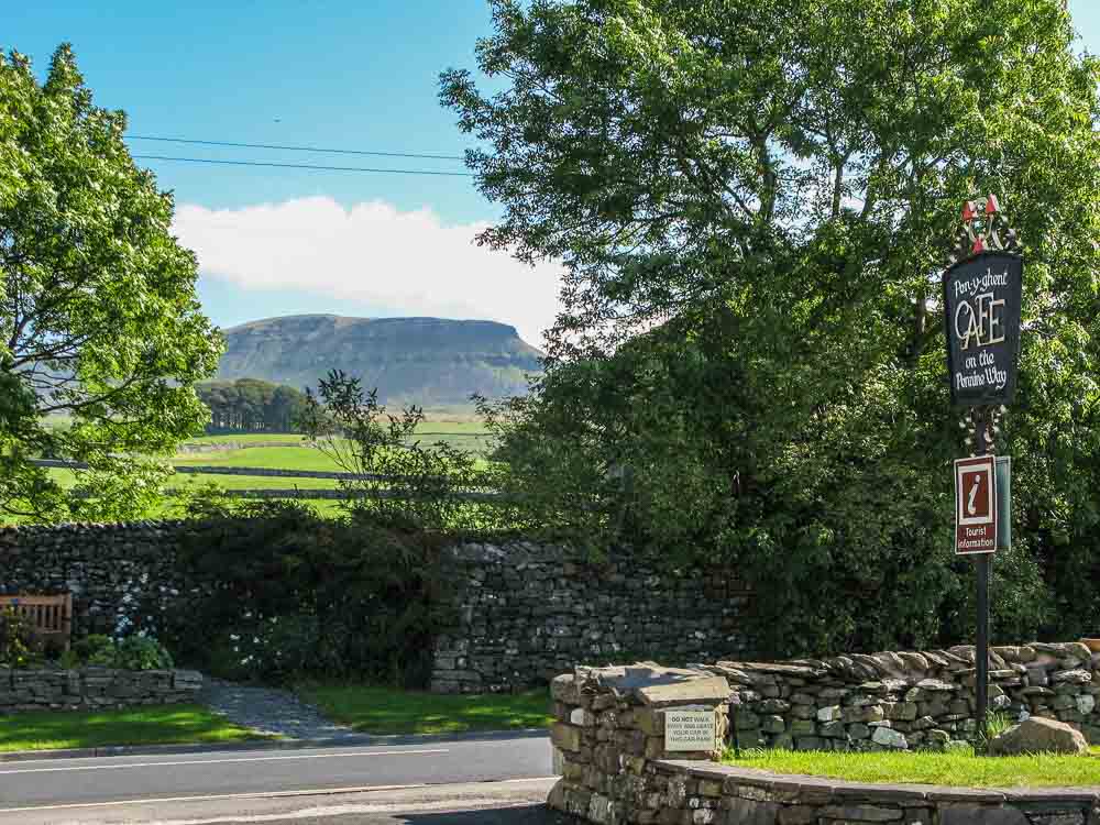 Pen y Ghen hill with the three peaks cafe sign in the foreground