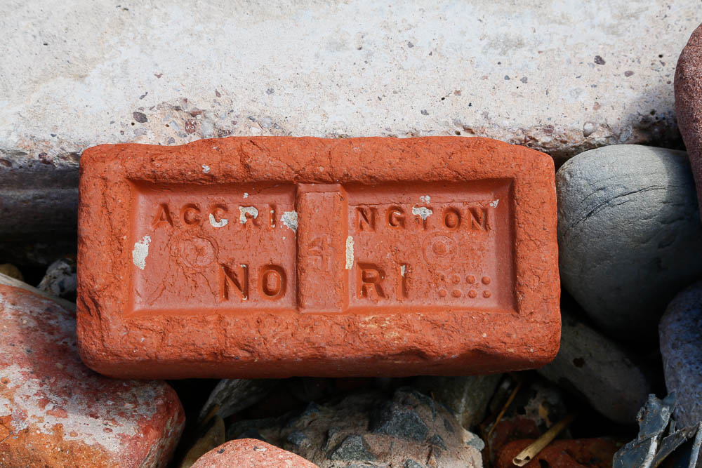 A red brick with the words Accrington and Nori embossed in the top