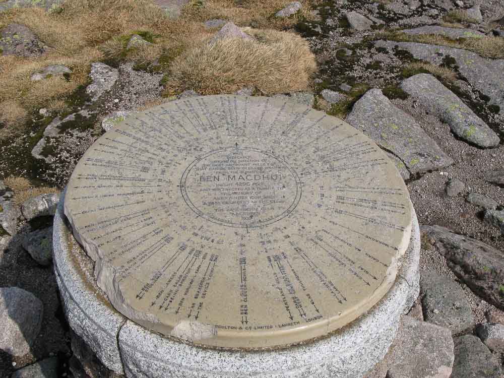 A ceramic plaque on the summit of Ben Macdui indicating all the summits and landmarks 360 degrees around